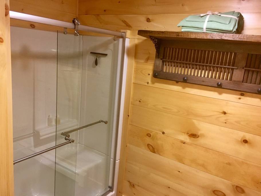 Brand new shower with ample space to sit down while you change.