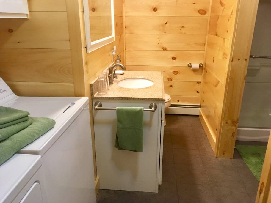 Newly remodeled bathroom with washer and dryer.